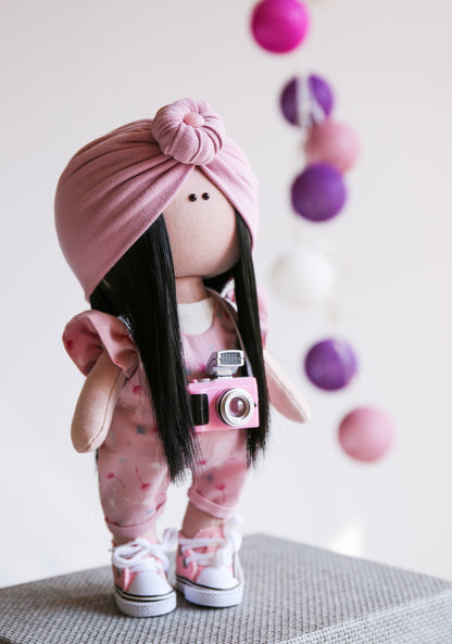 Pink photograph interior doll with a camera