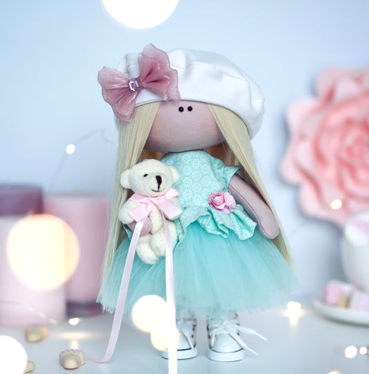 Turquoise princess interior doll in a ball gown dress