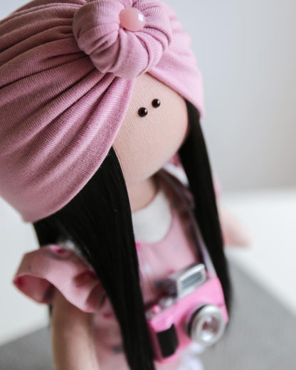 Pink photograph interior doll with a camera